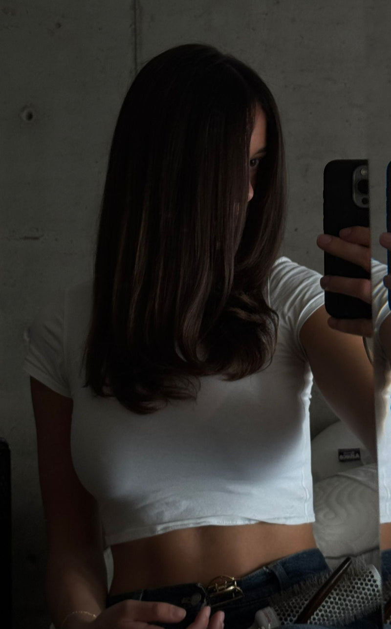 Healthy long hair showing visible growth and length retention from consistent hair oiling