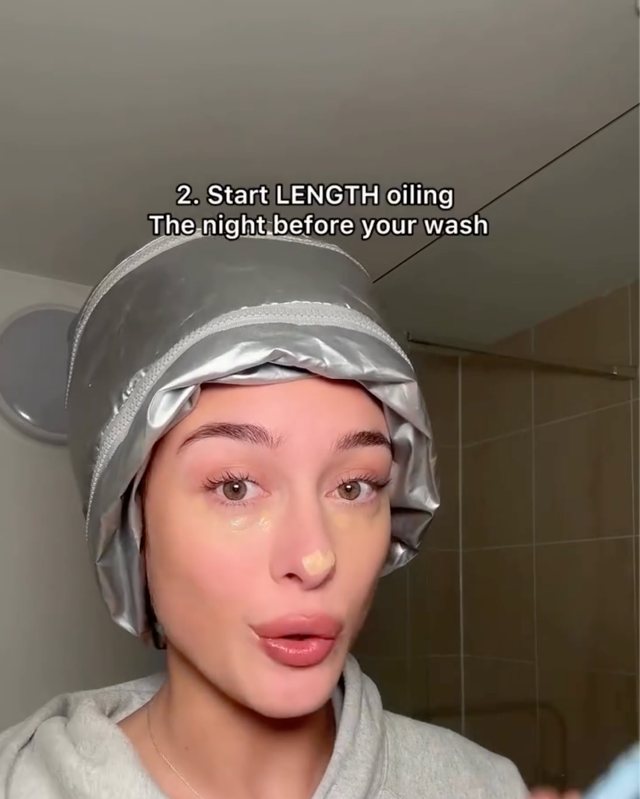 Still from the video: 2. start length oiling the night before your wash